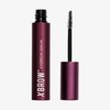 Ein 1,5-ml-Flakon XLASH Xbrow Augenbrauenserum, dessen Applikator entfernt wurde und nun daneben steht.