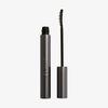 Geöffnete Tube „XLASH Drama Tinted Primer“ mit gebogenem Pinselapplikator, aufrecht auf weißem Hintergrund abgebildet.