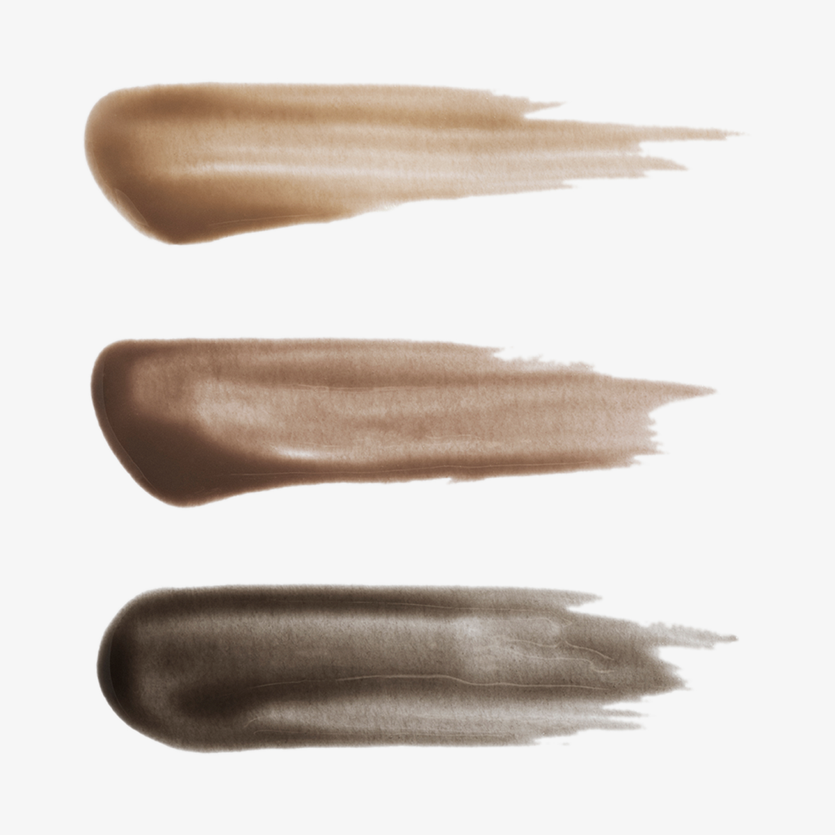 Drei horizontale Farbmuster des XLASH Brow Booster Augenbrauengels in den Farbtönen Hellbraun, Mittelbraun und Dunkelbraun.