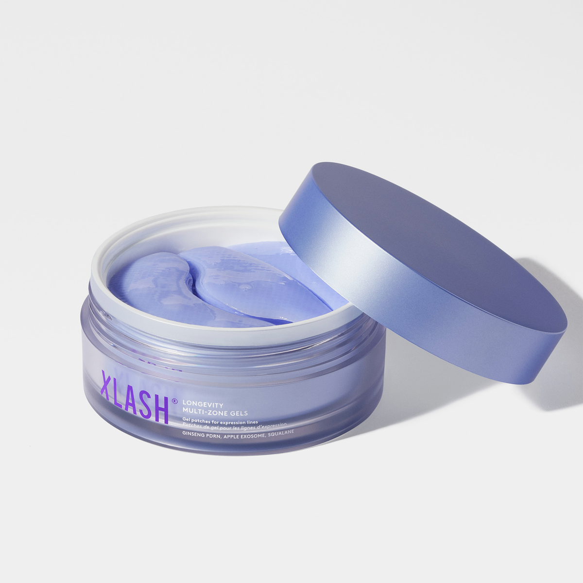 Öffnen Sie das Glas mit den violetten Longevity Multi-Zone Gels und legen Sie den Deckel daneben.