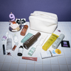 PURISH „Purish Favorites“-Tasche: ein Cupcake mit einer 9er-Kerze, einer Geschenkkarte und einem weißen Beutel auf Fliesen vor violettem Hintergrund.
