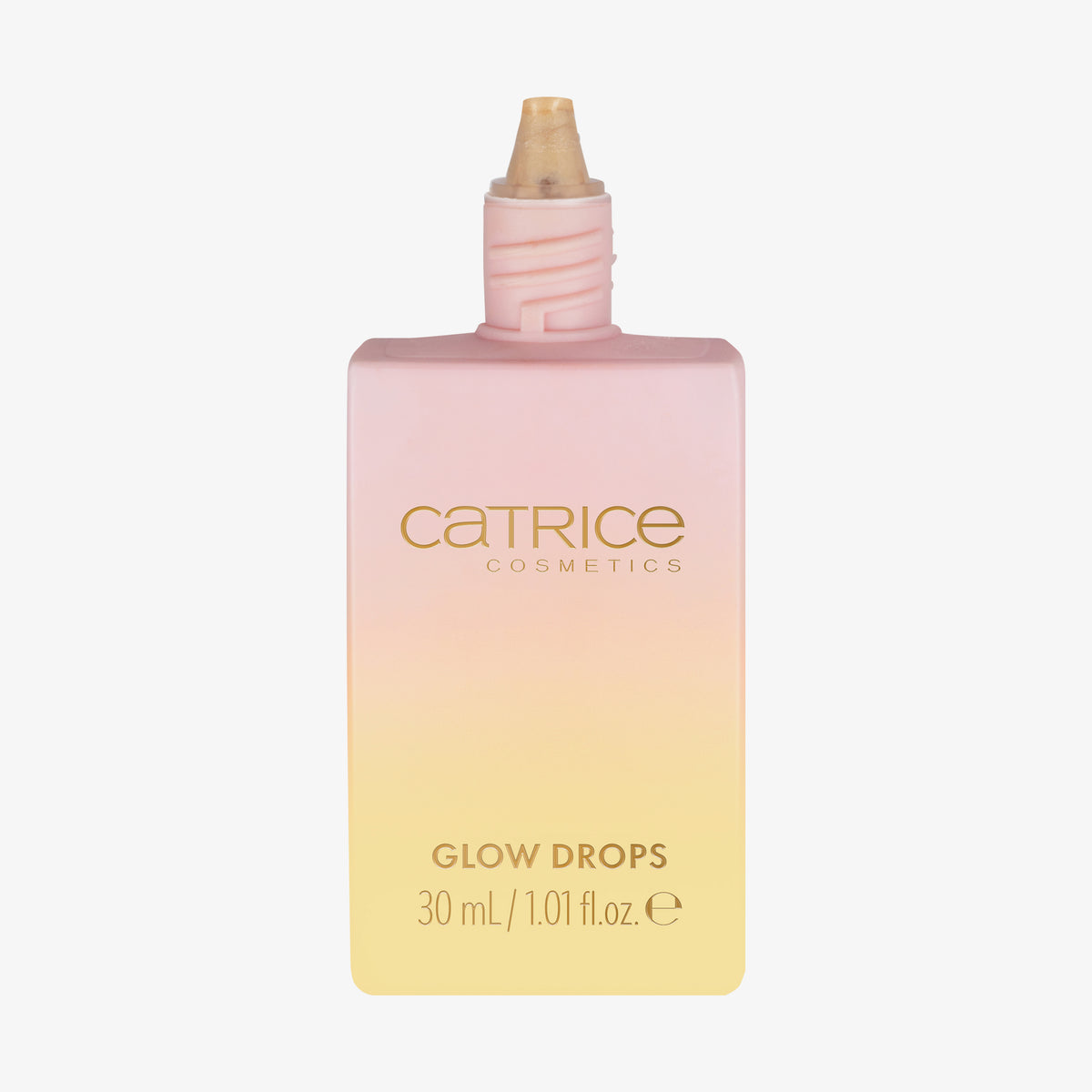 Ein geöffneter rechteckiger Flakon mit MIDNIGHT SUN Glow Drops von Catrice Cosmetics mit einem Farbverlauf in Rosa und Gelb.