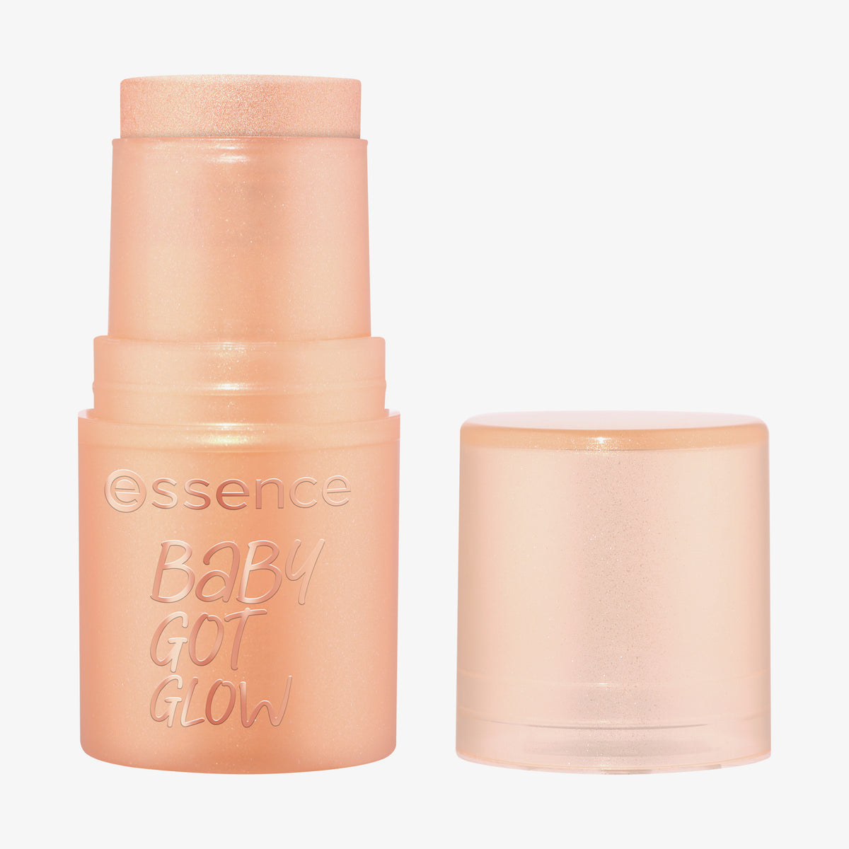 Essence BABY GOT GLOW Highlighter Stick in Pfirsich, hier ohne Kappe und daneben platziert.