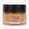 Glastiegel der Adventure Time Tree Trunks Lip Scrub von Lethal Cosmetics mit orangem Inhalt und schwarzem Deckel.