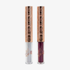 Zwei Tuben aus dem „The Legend of Korra – Asami Liner Set“ von Lethal Cosmetics, in Silber und Burgunderrot, mit goldenen Verschlüssen.
