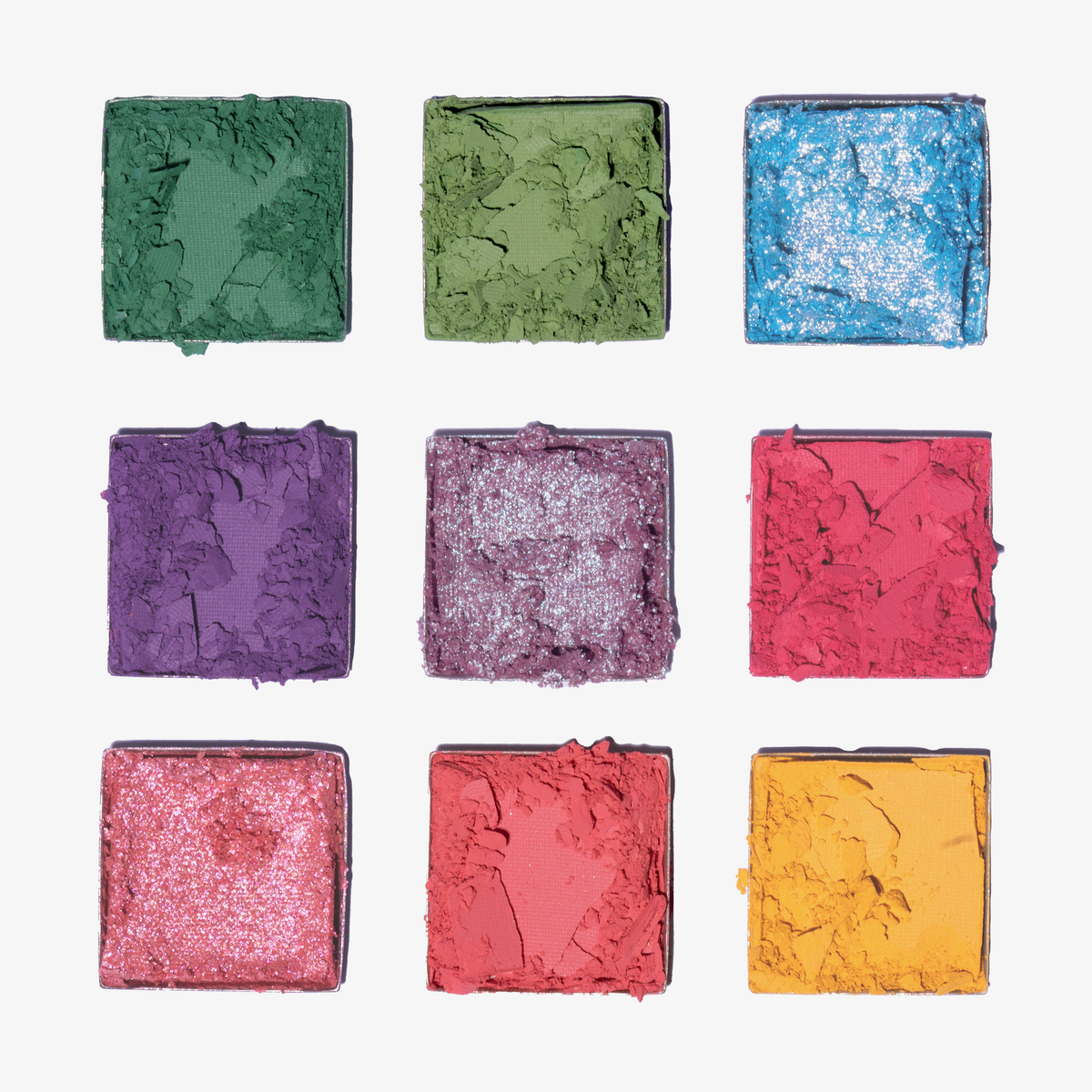 Neun kräftige Farbtöne aus der Palette 1993 von LH Cosmetics sind in einem Raster auf weißem Hintergrund angeordnet.