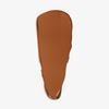 Ein Farbfleck der Foundation „Ctrl+ SKIN“ von LH Cosmetics in der Farbe „Medium Brown“ auf weißem Hintergrund.