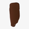 Ein dicker Strich der „Ctrl+ SKIN“-Grundierung von LH Cosmetics auf weißem Hintergrund.