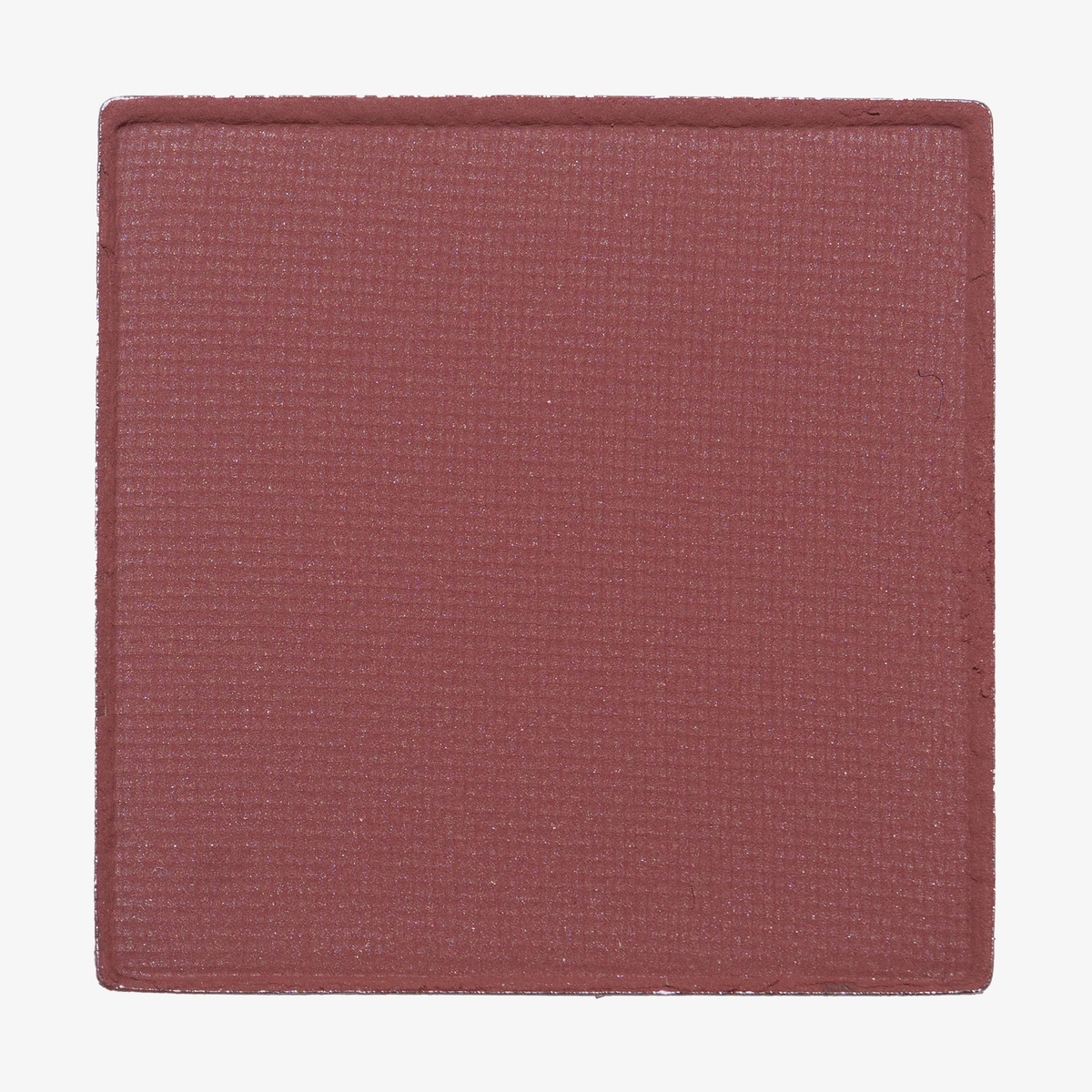 Ein quadratisches Pfännchen von LH Cosmetics The Single matte mauve blush mit einer strukturierten Oberfläche, abgebildet auf einem weißen Hintergrund.