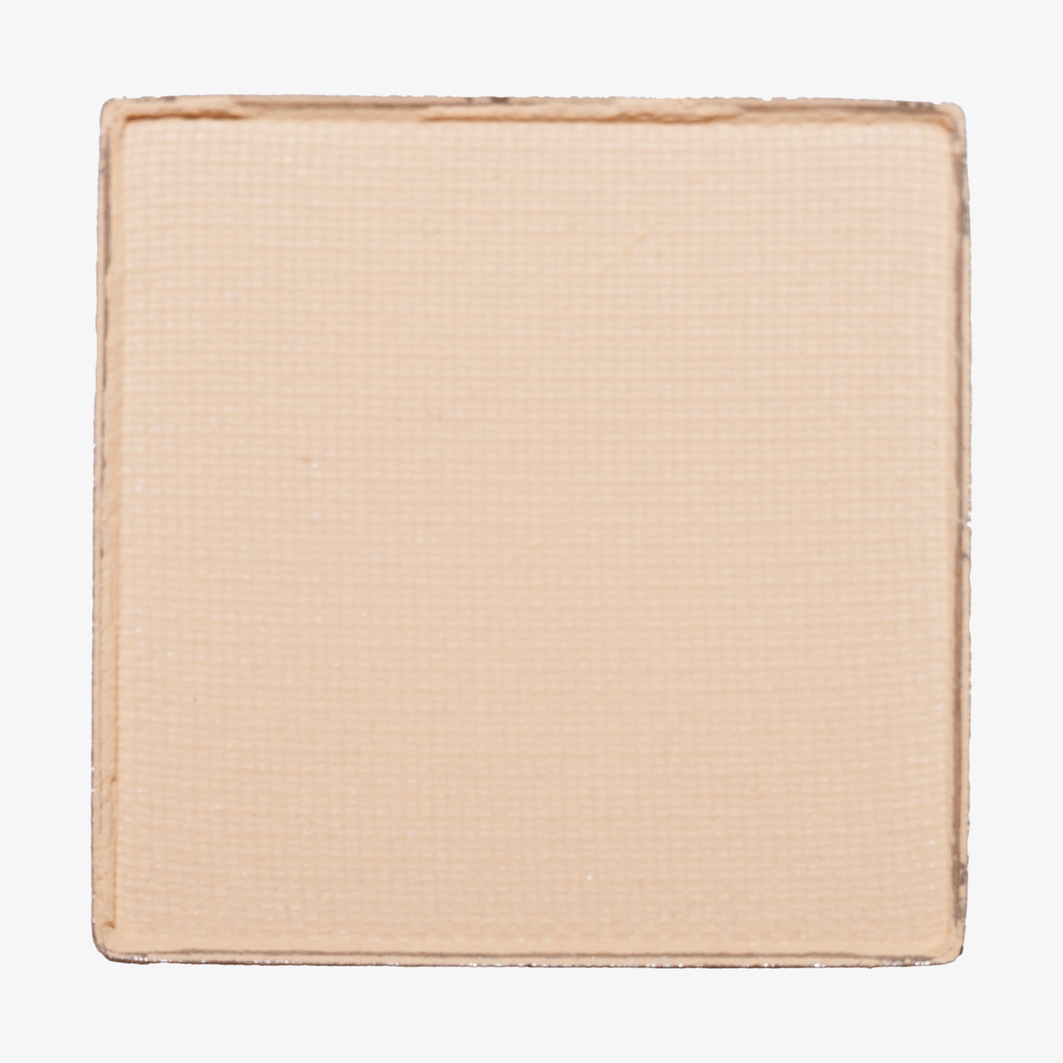 LH Cosmetics The single, eine quadratische Puderdose in hellem Pfirsichbeige mit einer subtilen gewebten Textur.