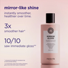 Eine rosa Flasche „Maria Nila Mirror Gloss Conditioner“ vor einem hellrosa Hintergrund, mit Produktversprechen im Text.