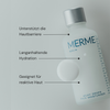 Eine Flasche MERME Milky Drops Face Moisturiser mit deutschem Text über Hautvorteile auf hellem Hintergrund.