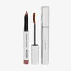 Ein SPACE GAZE CHRISTMAS KIT von Mesauda Beauty, bestehend aus einem Lidschattenstift und einer Mascara-Bürste mit Hülse.