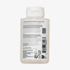 Eine weiße Flasche OLAPLEX N°3 PLUS Complete Repair Treatment mit Produktinformation und Barcode auf dem Rückenetikett.