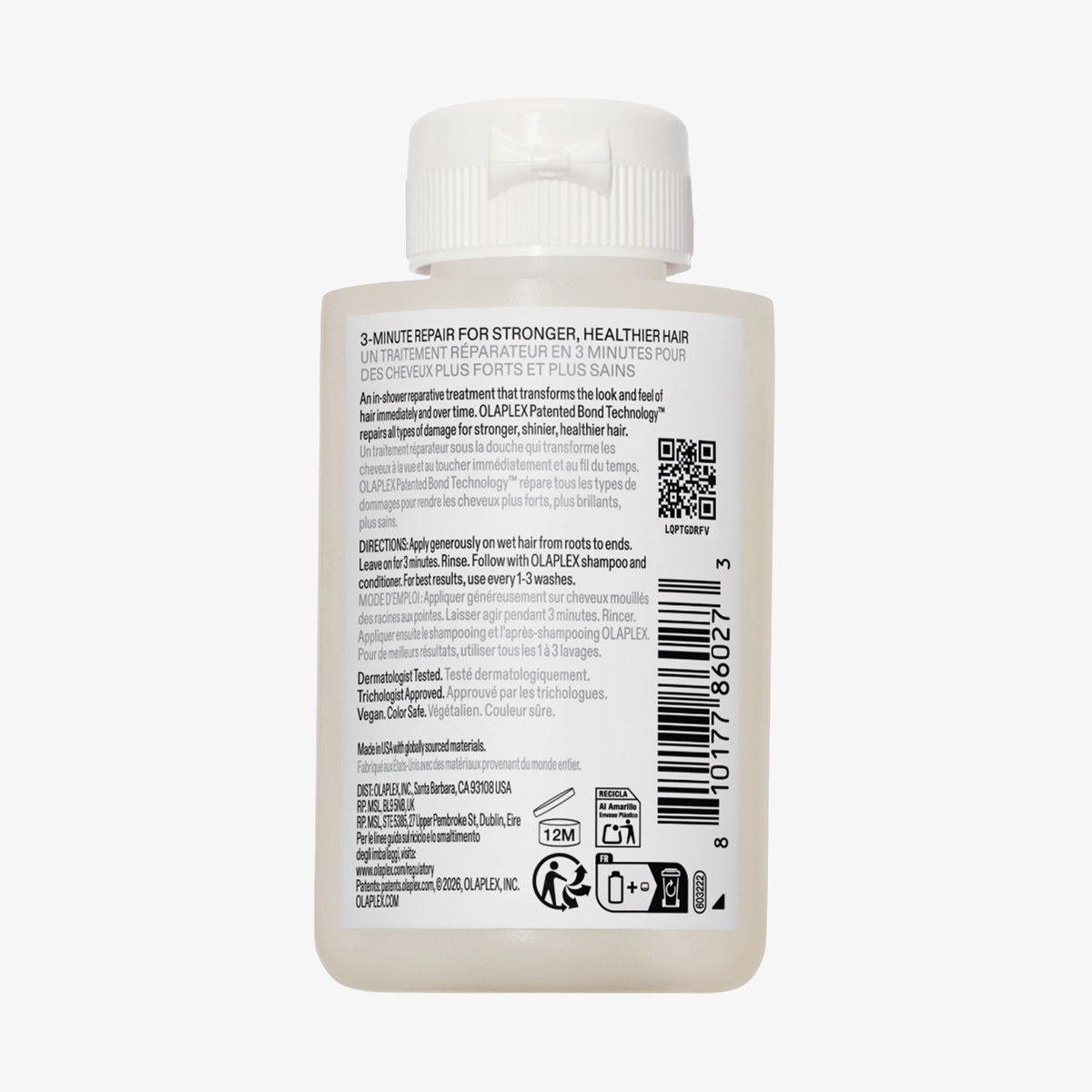 Eine weiße Flasche OLAPLEX N°3 PLUS Complete Repair Treatment mit Produktinformation und Barcode auf dem Rückenetikett.