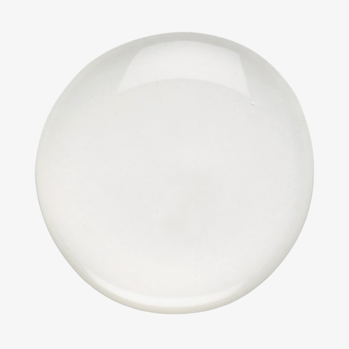 Ein runder, glänzender Tropfen „Philip Kingsley Density Preserving Scalp Drops“ auf einem schlichten weißen Hintergrund.