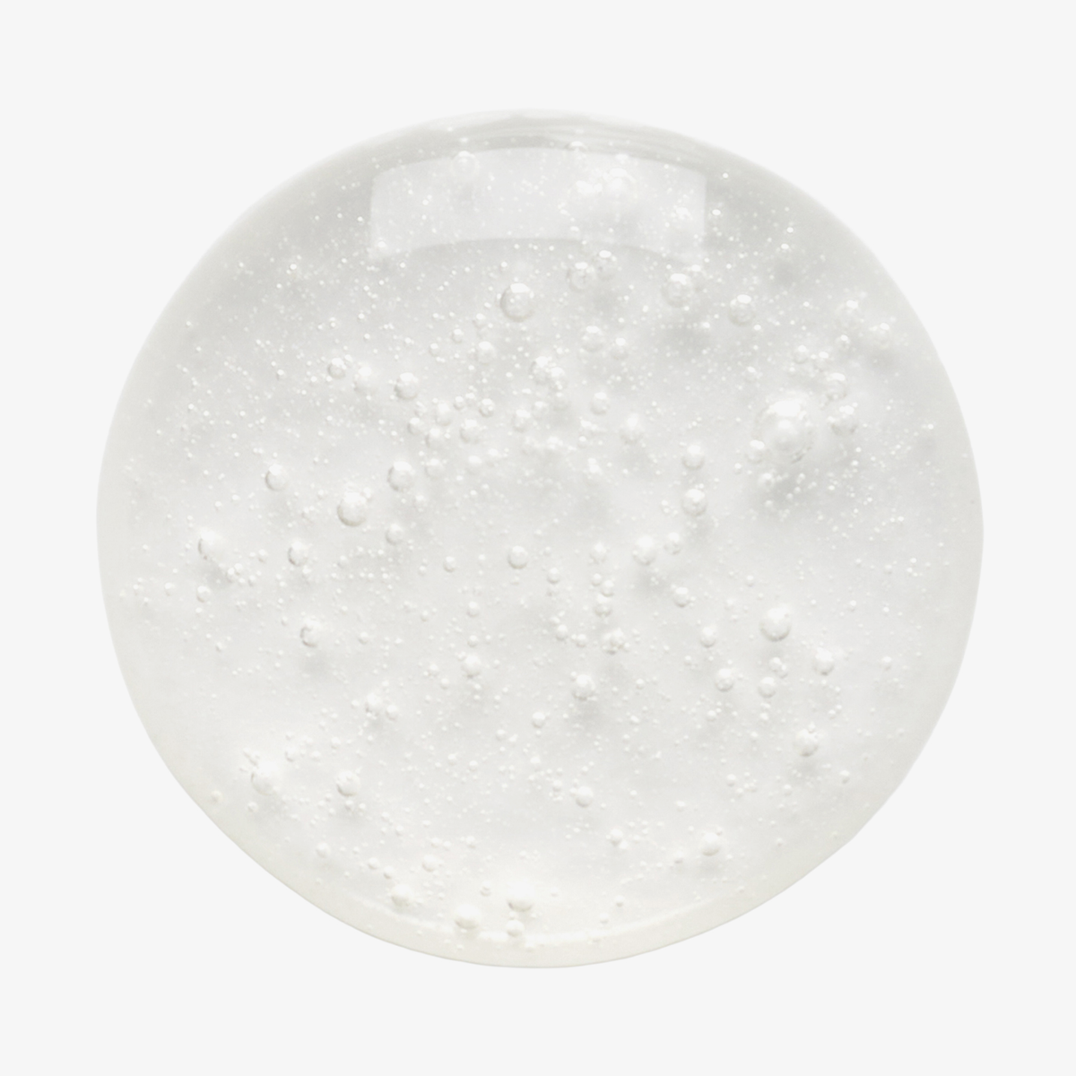 Philip Kingsley Density Shampoo-Gel mit Luftbläschen, von oben auf weißem Hintergrund gesehen.