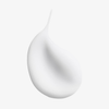 Ein glatter, glänzender Tropfen des „Moisture Balancing Conditioner“ von Philip Kingsley vor einem schlichten weißen Hintergrund.