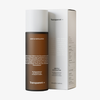 Eine braune Flasche Gentle Exfoliator von Transparent Lab steht neben ihrer weißen Verpackung.