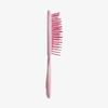 UNbrush Detangling Hair Brush Mini in Rosa, mit abgesetzten Borsten, aufrecht im Seitenprofil auf weißem Hintergrund dargestellt.