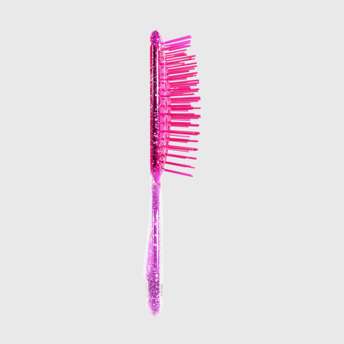 Die UNbrush Detangling Hair Brush Mini ist mit rosa Glitzer und Kunststoffborsten auf grauem Hintergrund versehen.