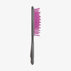 UNbrush Detangling-Haarbürste in Grau mit rosa Borsten, dargestellt auf weißem Hintergrund.