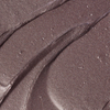 BLONDESISTER GLOWEYE LIDSCHATTEN: Schimmerndes Mauve in Cremeform, metallischer Glanz, geschmeidige Textur, sanfte, wellenförmige Rillen auf der Oberfläche.