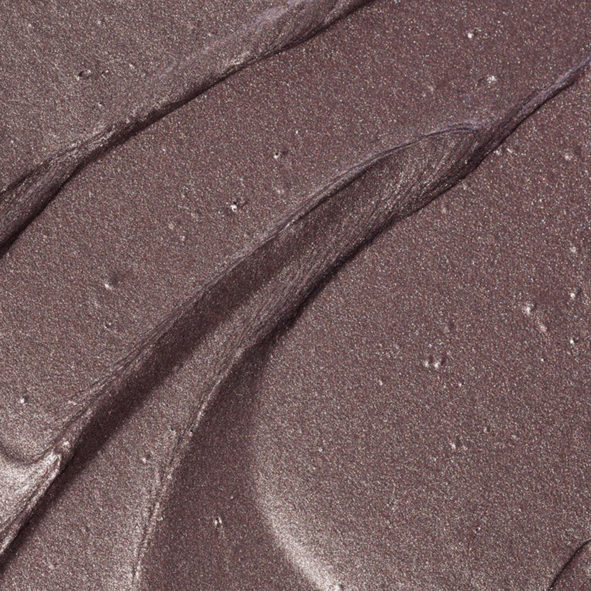 BLONDESISTER GLOWEYE LIDSCHATTEN: Schimmerndes Mauve in Cremeform, metallischer Glanz, geschmeidige Textur, sanfte, wellenförmige Rillen auf der Oberfläche.