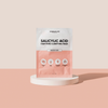 Einweg-Packung Breakout+Aid Salicylic Acid Clarifying Mask auf einem weißen, runden Sockel.