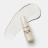 Catrice Cosmetics Glass Like Highlighter Stick 010 auf weißem Hintergrund mit einer Produktprobe dahinter.