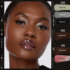 Eine Frau trägt Danessa Myricks Beauty Colorfix Mattes auf Augen, Gesicht und Lippen: schimmernder Silberschatten, glänzende dunkle Lippen.
