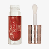 Ein rot schimmerndes „The Legend of Korra – Embered Lip Plumping Oil“ von Lethal Cosmetics mit einem braun-weißen Applikatorstift.