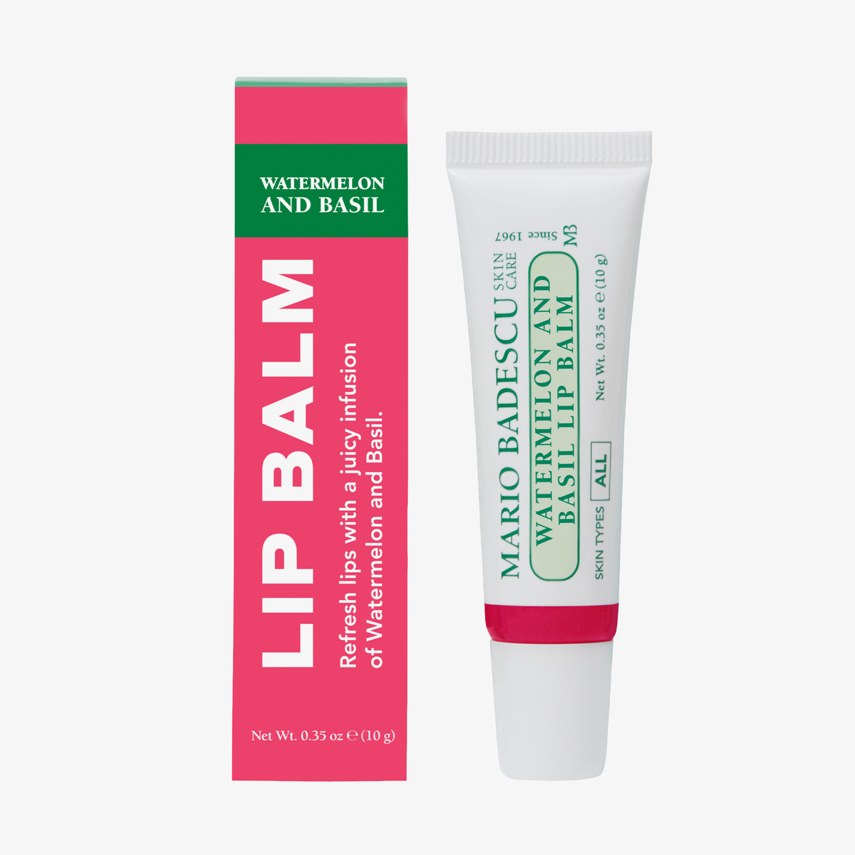 Mario Badescu Granatapfel und Guave Lippenbalsam Tube neben seiner rosa und grünen Box auf einem weißen Hintergrund.