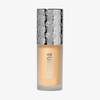Eine Flasche Mesauda Beauty STELLAR GLOW CHRISTMAS KIT Flüssigfoundation mit einem silberfarben gemusterten Verschluss.