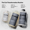 OLAPLEX N°5 CURL Bond Shaper Conditioner mit Bläschen auf grauem Hintergrund als Teil einer Lockenpflege-Routine.