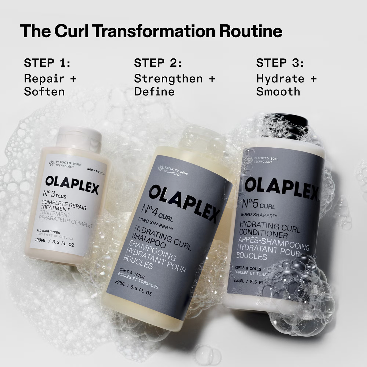 OLAPLEX N°5 CURL Bond Shaper Conditioner mit Bläschen auf grauem Hintergrund als Teil einer Lockenpflege-Routine.