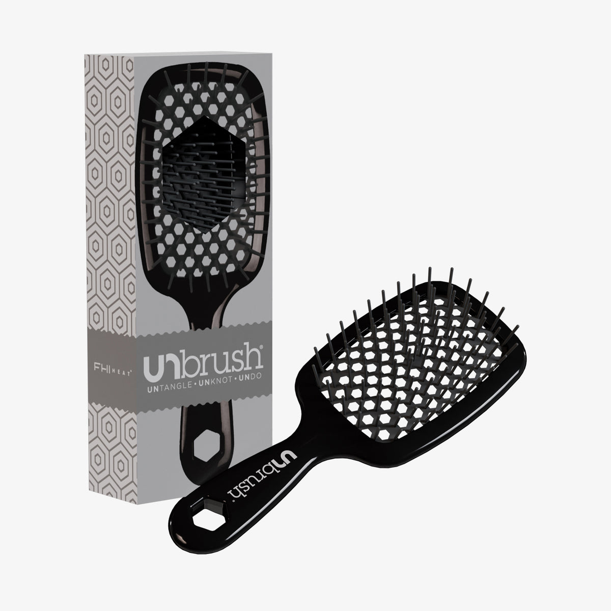 Die schwarze UNbrush Detangling-Haarbürste mit sechseckigem Muster wird neben der passenden Verpackungsbox präsentiert.