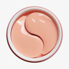 Auf dem Etikett eines geöffneten Tiegels mit „XLASH Awakening Eye Gels“ sind zwei hellrosa, halbmondförmige Hydrogel-Pflaster auf weißem Hintergrund abgebildet.