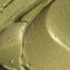 Nahaufnahme des BLONDESISTER GLOWEYE-LIDSchattens – glänzende goldene Textur, cremige Streifen und vereinzelte Bläschen.