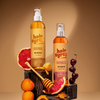 Zwei Flaschen Hair Syrup Pre-Wash Oil mit Aprikosen, Honig, Mandeln, Kirschen und Grapefruit.