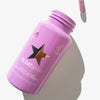 Eine Flasche BLOATamin™ 1 Month, gefüllt mit Kapseln, liegt auf einer weißen Oberfläche und wirft einen Schatten.
