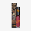 Eine Tube „Over The Garden Wall Poetry & Clarinet Velvet Liquid Lipstick“ von Lethal Cosmetics in einer Verpackung mit Motiven der Figuren aus der Serie.