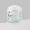 Numbuzin No.1 Pantothenic B5 Active Soothing Cream im hellgrünen Tiegel mit weißem Deckel vor grauem Hintergrund für beruhigende Hautpflege.