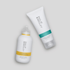 Philip Kingsley Body Building Shampoo und Moisture Balancing Conditioner vor einem hellgrauen Hintergrund.