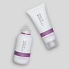 Zwei „Philip Kingsley Moisture Extreme“-Shampoos auf grauem Hintergrund: eine Flasche und eine Tube, beide mit violetten Etiketten.