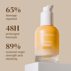 Eine Flasche „Abyssian Dream Bonds Bio Emulsion“ auf einem Sockel, mit Angaben zu Reparatur, Frisur und Stärke auf beigem Hintergrund.