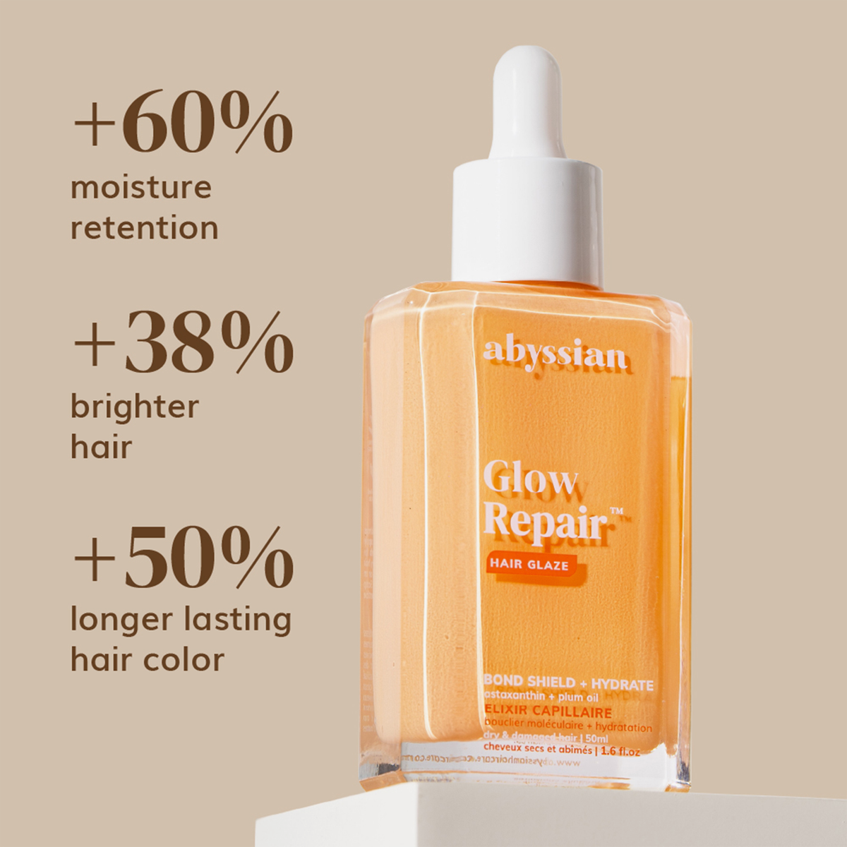 Abyssian Glow Repair Hair Glaze-Flasche mit Angaben zu Feuchtigkeitsversorgung, Glanz und Farbbeständigkeit auf beigem Hintergrund.