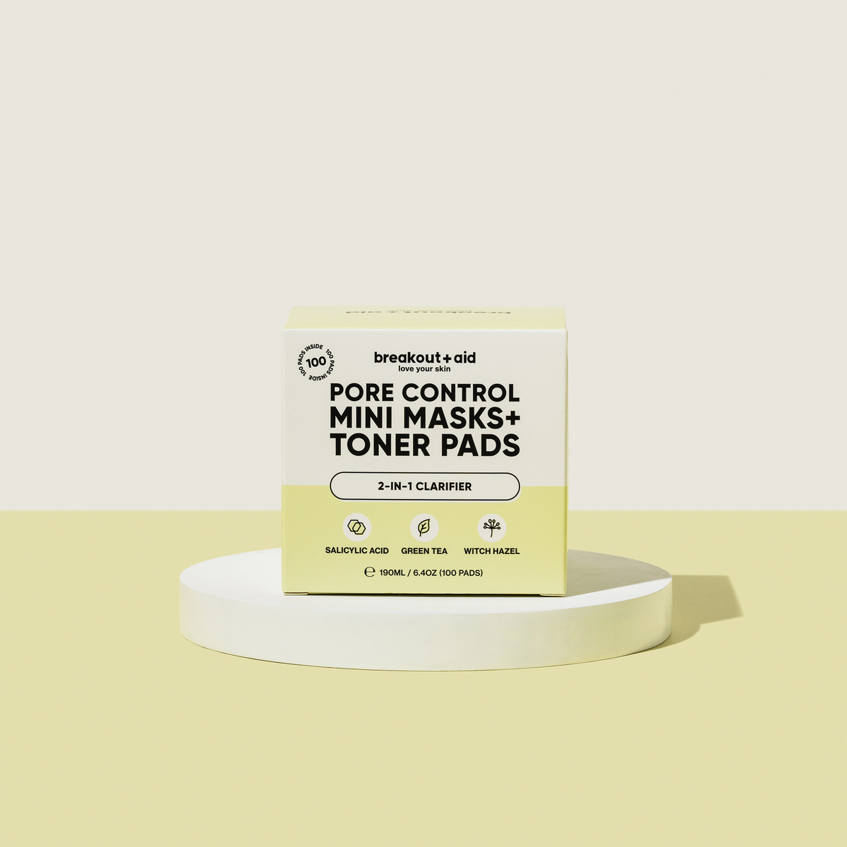 Schachtel mit Square Breakout+Aid Pore Control Mini-Masken und Toner-Pads, beschriftet mit den Begriffen Salicylsäure, grüner Tee und Hamamelis.