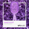 Kleine Versione der UNbrush Glitter Duo Wet and Dry Detangling Brush von UNbrush auf einem Amethystkristall-Hintergrund abgebildet.