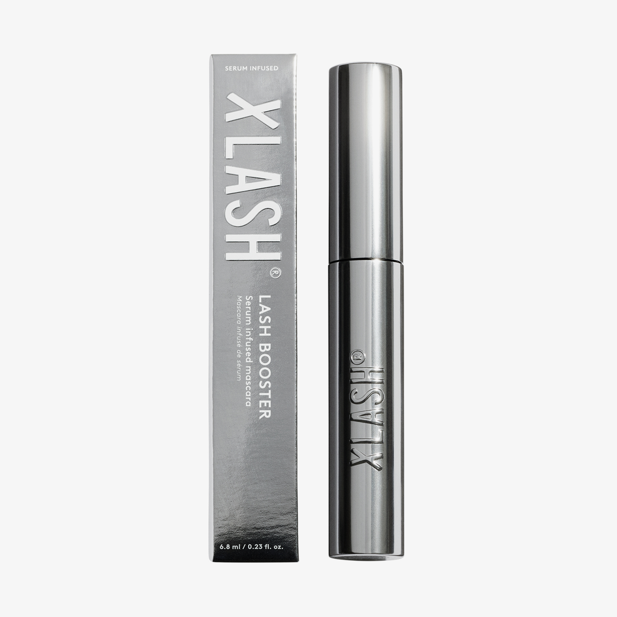 Eine silbermetallisch glänzende XLASH Lash Booster-Mascara-Tube und die dazu passende rechteckige Schachtel.